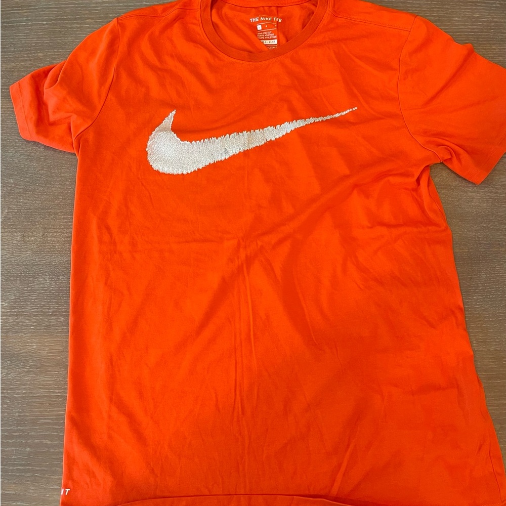 large orange nike logo shirt